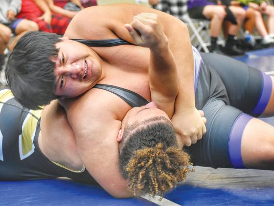 Fabian Perez pins his opponent in Clear Creek Middle School’s 44-30 victory versus Commerce at the duals state tournament.