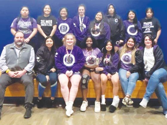 Above are Gilmer High School’s coaches with area wrestling winners and placers last Friday in Lumpkin County.