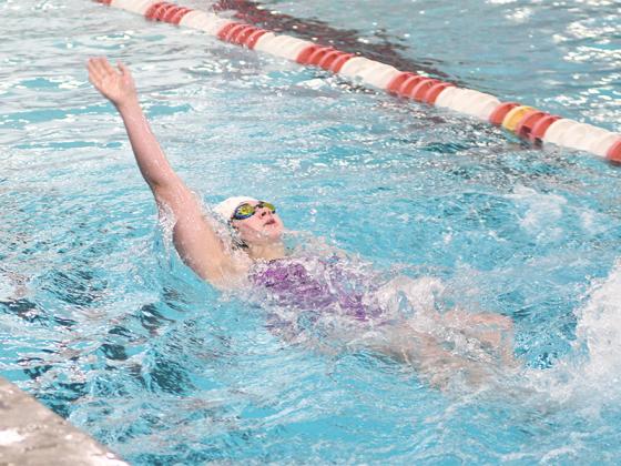 Gilmer High’s Evan May swims the backstroke for the Lady Cats during last season. (Photo by Robbie Bills/Sports Editor)