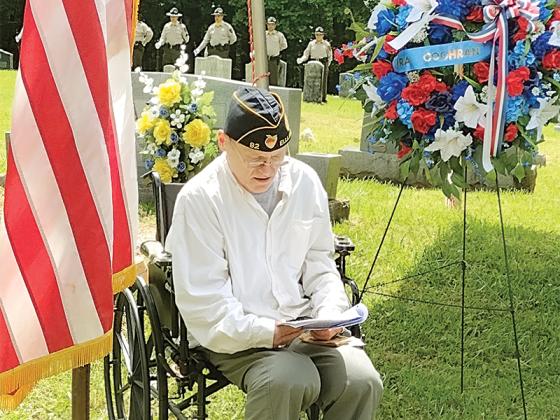 American Legion Post 82 member Wade Youmans reads about the life of Ira Cochran at the ceremony honoring him last week on May 22, exactly 106 years to the day he was killed in World War I. 