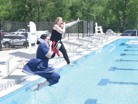 Jennifer Grimmer, Gilmer County Chamber of Commerce president and CEO, and Rebecca Harrell, Gilmer County Chamber of Commerce 2024 board chair, took the plunge during the ribbon cutting for the Gilmer County pool May 1. The pool is slated to open Memorial Day weekend.