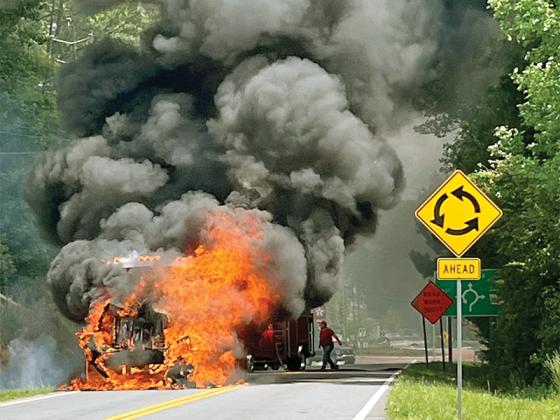 Smoke billows after a rollaway dumpster truck caught fire in the southbound lane of Old Highway 5 last week. (Photo by Al Cash)