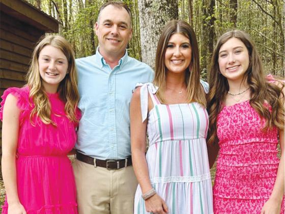 New Gilmer cheer director Lori Cantrell is joined by husband Jody Cantrell and daughters Lola Howard and Jada Howard.