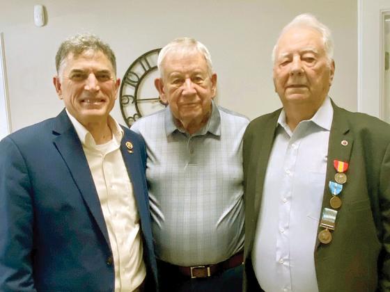 Jesse Westbrook, right, received the Korean Service Medal, United Nations Service Medal and the National Defense Medal during a presentation at Ellijay’s United Community Bank in mid-June. U.S. Rep. Andrew Clyde of Georgia’s Ninth Congressional District, left, helped procure the medals through a request originated by Westbrook’s friend, Ralph Cox, center. It’s been 71 years since Westbrook served in Korea. 