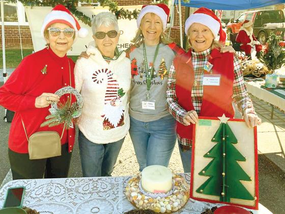 Ellijay Farmers and Artisans Market volunteers Ginny Bellinato, Lynn Robey, Chris Cleberg and Betty Sammis were in the holiday spirit during last year’s Christmas in July.