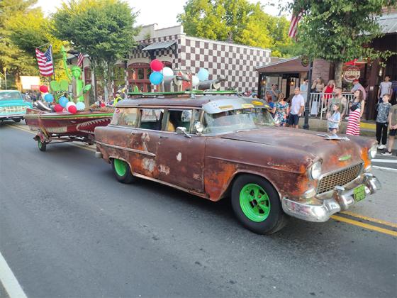 Ronnie Prater’s Rat Rod pulling a boat and trailer piloted by Rat Fink is an offbeat sight in any proper July 4 processional. (Photo by Mark Millican)