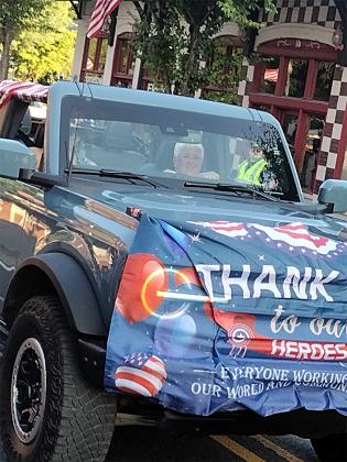 Danette Ozment of the Captain James Kell Chapter of the National Society of the Daughters of the American Revolution drives a jeep honoring veterans in the Independence Day parade. (Photo by Mark Millican)