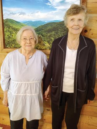 After around six decades, old friends Mary Lou Hipp, left, and Brenda Sailors Blanton were reunited during a surprise luncheon at the local Berkshire Hathaway real estate office.