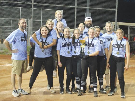 Above are the undefeated Gilmer Recreation and Parks 13 and under girls softball team. From left, coach Jeff Wilcox, Layla Duvall, Parker Blue Williams, Trinity Johnson, Isabella Teams, Natalie Wilcox, Jesse Wheeler, Melissa Rasmussen, coach Roberto Murillo, Jocelyn McCollum, Abby Murillo, coach Joseph McCollum and Bailee Cartin. ​​​​​​​