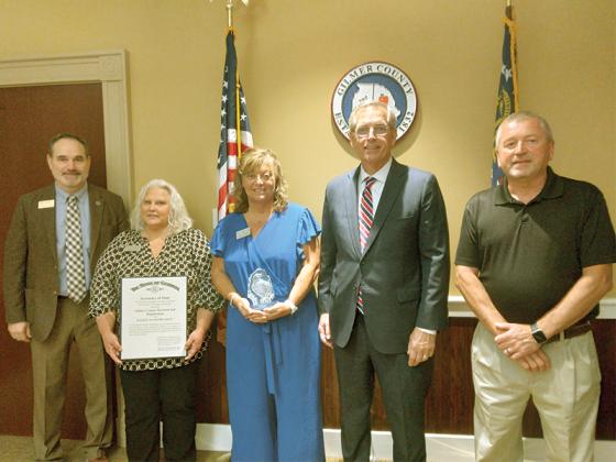 Georgia Secretary of State Brad Raffensperger presents the EAGLE Award to  members of the Gilmer County Registrar’s Office and Elections Department. Pictured, from left: Probate Judge and Election Superintendent Scott Chastain, registrar Sherri Jones, Chief Registrar Tammy Watkins, Raffensperger and voter registration board member Mark Holden.