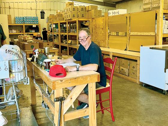 Volunteer Lindsey Porter logs in food items as the truck from the Chattanooga Area Food Bank delivers to the Gilmer Community Food Pantry each Tuesday at their 5273 Highway 52 East location. 