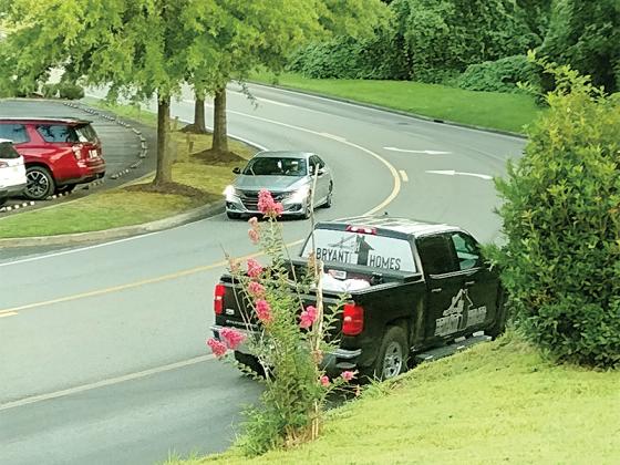 This busy northernmost entrance to Highland Crossing shopping center off Highway 515 will soon have construction equipment nearby. An underground pipe will be worked on at night, but disruptions to traffic are possible, according to East Ellijay Police Chief Larry Callahan.