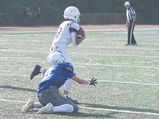Clear Creek’s Noah Rice steps in front of a Fannin County receiver for an interception last Wednesday. Rice picked off another Rebel pass in the third quarter of the eighth-grade’s victory.