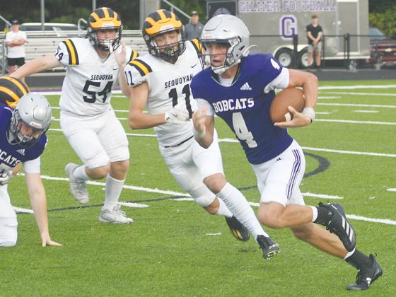 GHS quarterback Issac Rellinger makes his way around the edge on his 52-yard touchdown run versus Sequoyah last Friday.