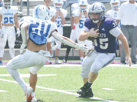 Gilmer’s Wyatt Stokes (left) leaves a Rebel defender grasping at air, and he ran for 97 yards and two touchdowns last Saturday.