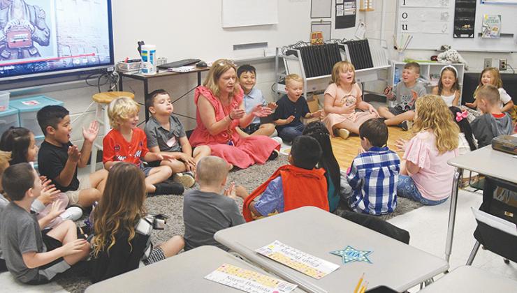 Students in Nicole Imbriano’s first-grade class sing a song to remember each other’s names.