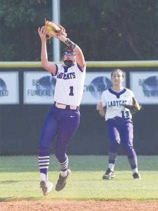 Gilmer’s Makayla Martin makes a catch for the Lady Cats and is backed up by Melissa Rasmussen.