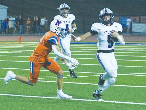 Gilmer’s Hunter Britain escapes a Northwest Whitfield defender last Friday and led the Bobcats with 87 rushing yards on 11 attempts.