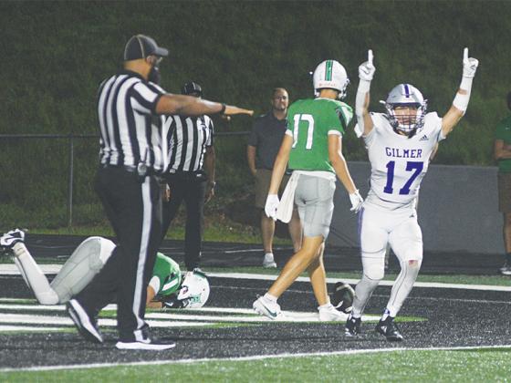 Bobcat safety Bo Cronic celebrates Gilmer’s win as reality sets in for the dejected Dragons.