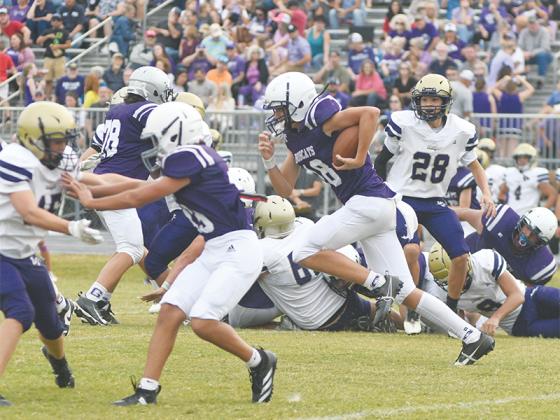 Clear Creek eighth-grade quarterback Slade Smith gets around the edge on his 66-yard touchdown run versus Lumpkin County last Wednesday.