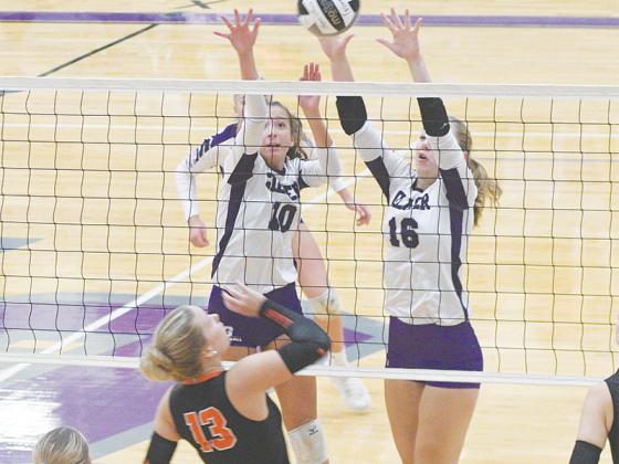 Gilmer’s Madison Bradshaw and Lilyan Cook go up for a block