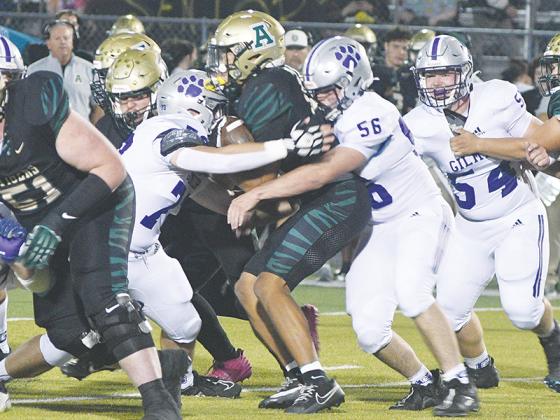 Gilmer’s Logan Hightower (73) and Jake Hice (56) team up for a tackle versus Adairsville last Friday as fellow senior Blane Banks (54) closes in to assist.