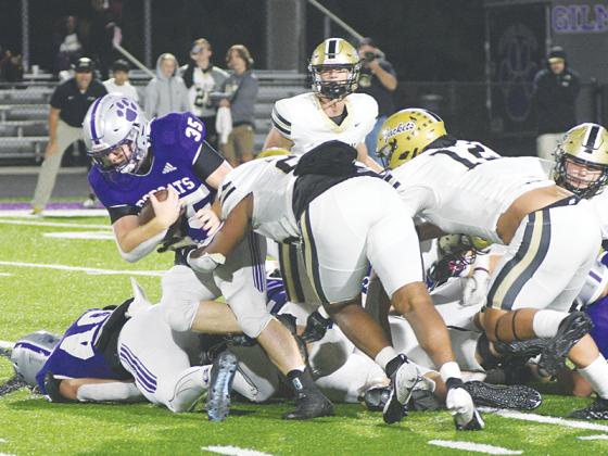 Gilmer High senior fullback Wyatt Stokes makes his way through Calhoun’s defense last Friday and ran for 106 yards.