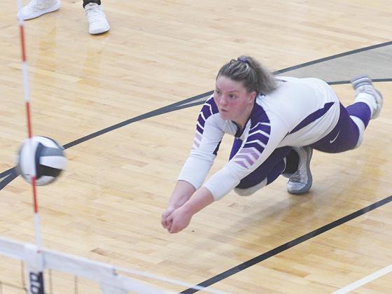Maddie Usry goes down for a dig