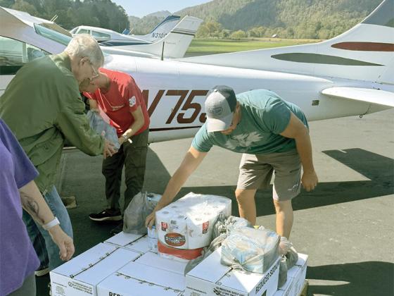 At the Gilmer County Airport, volunteers load a plane with supplies bound for those affected by Hurricane Helene. 