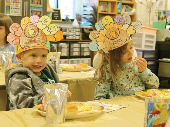 Riley Crump and Alivia Bassett wore their turkey hats while snacking in Kalin Zagarola’s class.
