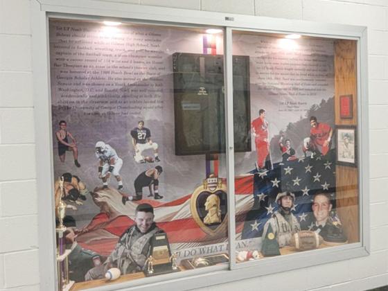 The Noah Harris Wrestling Center opened last Tuesday and will house all of Gilmer County’s wrestling teams. Above is the lobby display of the late Noah Harris’ life from his time as a middle school wrestler, a GHS student athlete, UGA cheerleading captain and 1st Lieutenant in the U.S. Army.