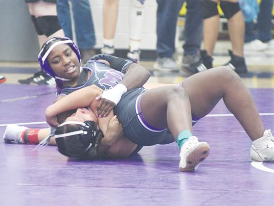 Gilmer High senior Amayah Jones secures a pin last Saturday.