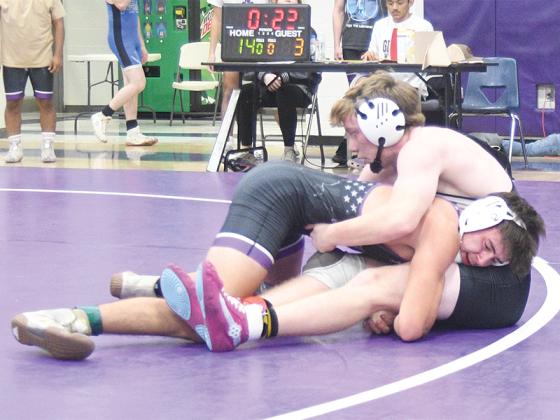 Gilmer High senior captain Harrison Chester scores a takedown last Tuesday.