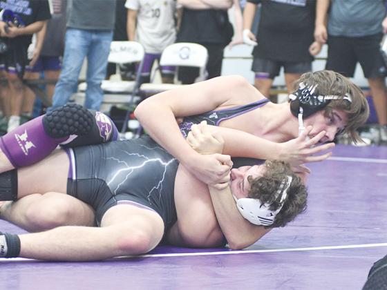 Gilmer High’s Augustus Lamey secures a pin last Thursday to cement Gilmer’s victory over No. 6 ranked Union County.