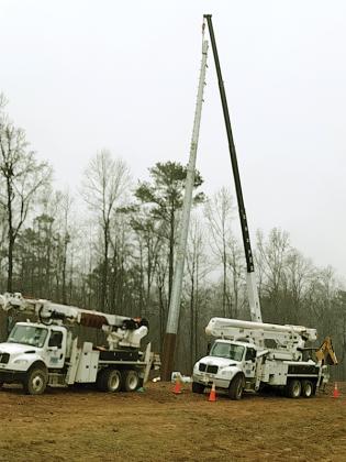 A crew was spotted Monday putting up a transmission line pole just south of Northcutt. Several poles are already erected in East Ellijay.