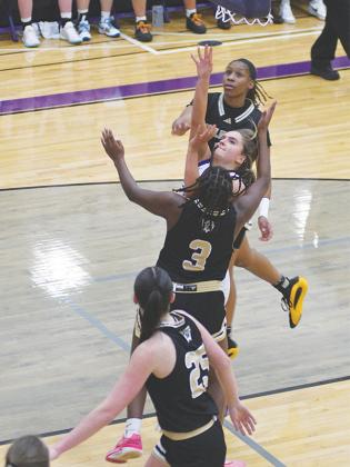 Lady Cat junior Bree Burnette dives for two of her 18 points versus Calhoun.