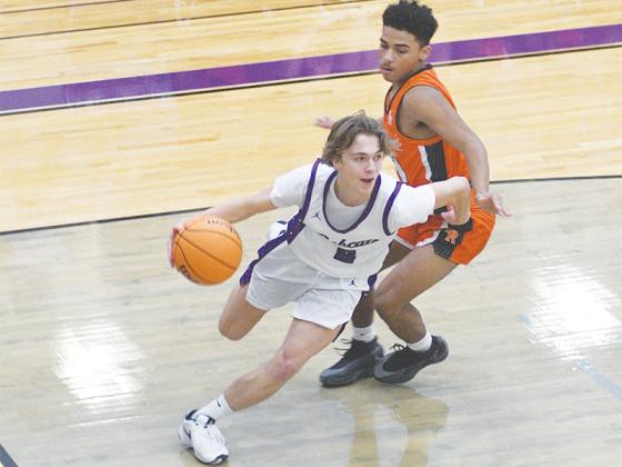 Gilmer senior Cooper Farmer beats his LaFayette defender off the dribble ahead of a layup.
