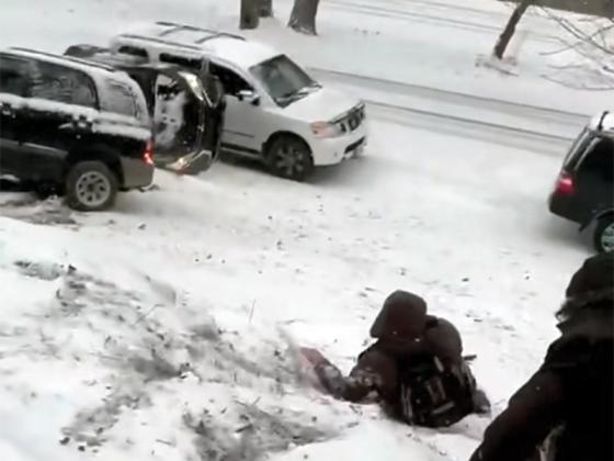 Photo captured from video posted to GCSO’s Facebook page on Friday. An SUV slid down Ogden Drive in the Coosawattee River Resort, hitting two parked vehicles. No serious injuries were reported.