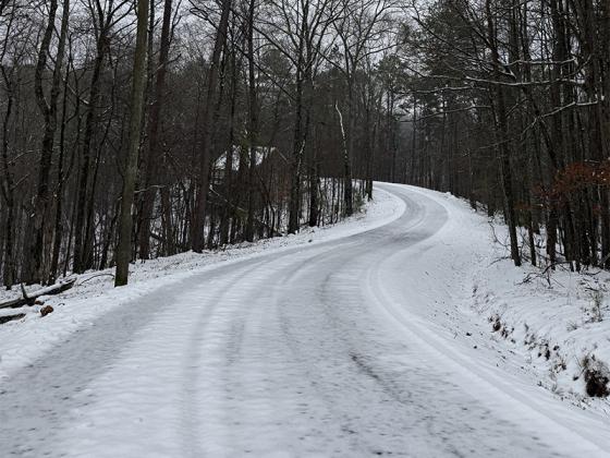 Snowy road by Lauren Sabia