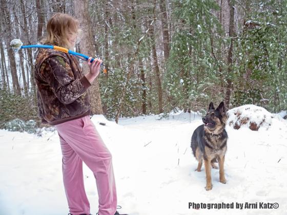 Bre Wilson and german shepard Kane play in the snow. Photographed by Arni Katz©
