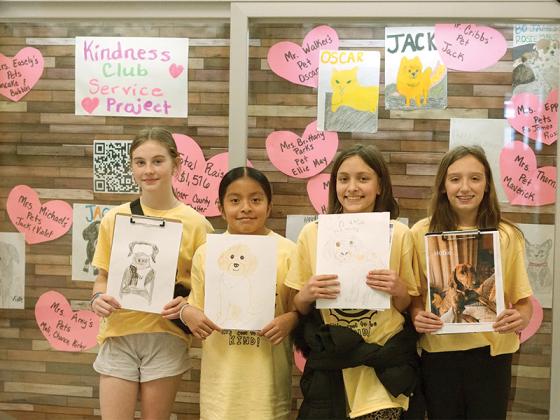 From left to right, club ambassadors Ava Williamson, Nancy Perez, Kendall Messer and Faith Dotson highlight the pet portraits they are currently working on. 