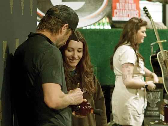 Blue Ridge resident Stephanie Drake purchases five autographed bottles of ROW 94.
