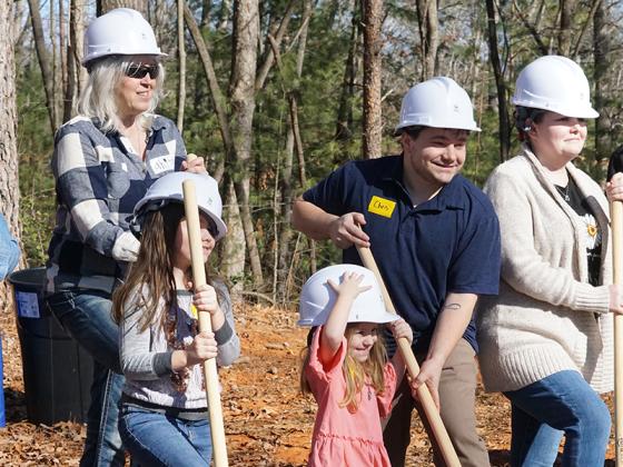 The Abercrombies break ground on where their new three-bed, two-bath home will be along Roberts Ridge Road in Ellijay.