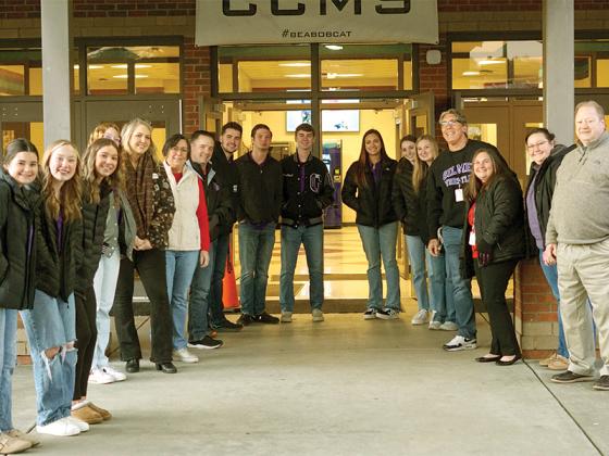 Members from the Lead Gilmer student organization, Chamber of Commerce and Board of Education greet students on Valentine’s Day morning.