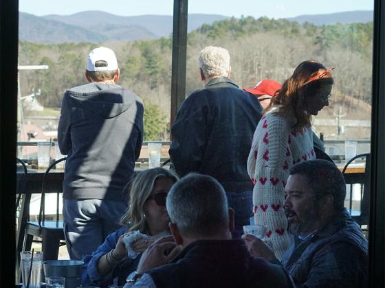 The indoor seating at the Roof is surrounded by floor-to-ceiling windows, allowing every customer to enjoy the mountain views. 
