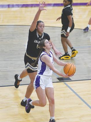 Lady Cat sophomore Jaylee McDaniel drives the baseline for a reverse layup and scored nine points versus Murray County.