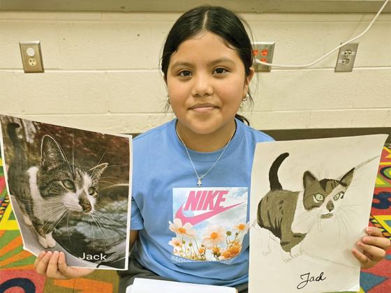 4th grader Daniela Ramirez Garcia works on a pet portrait.