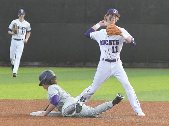 Gilmer High School senior second baseman Haden West attempts to turn a double play versus Lumpkin County.