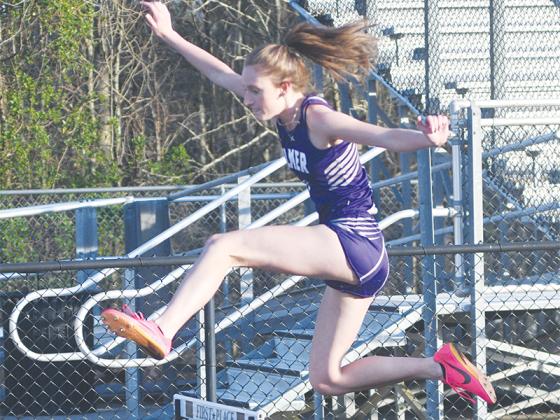 Addie Vick competes in the 300-meter hurdles and placed first.