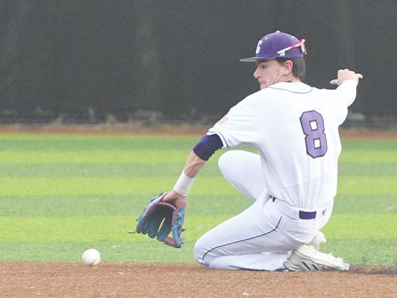Gilmer senior shortstop Eli Cooper makes a backhanded stop last  Friday versus Heritage.